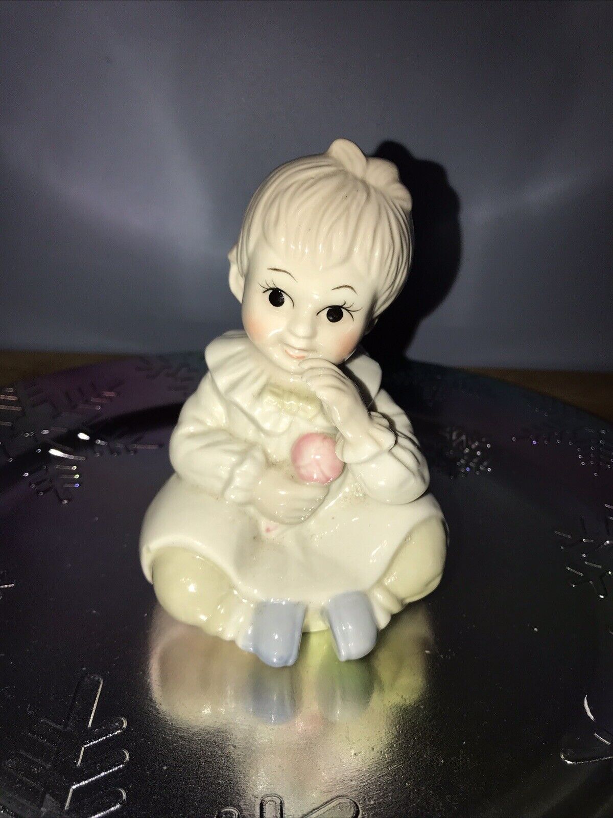 Porcelain Sitting Baby Girl with Rattle Piano Figurine 5.25\