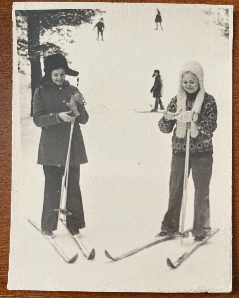 Beautiful Soviet young women on skis on snow Vintage photo