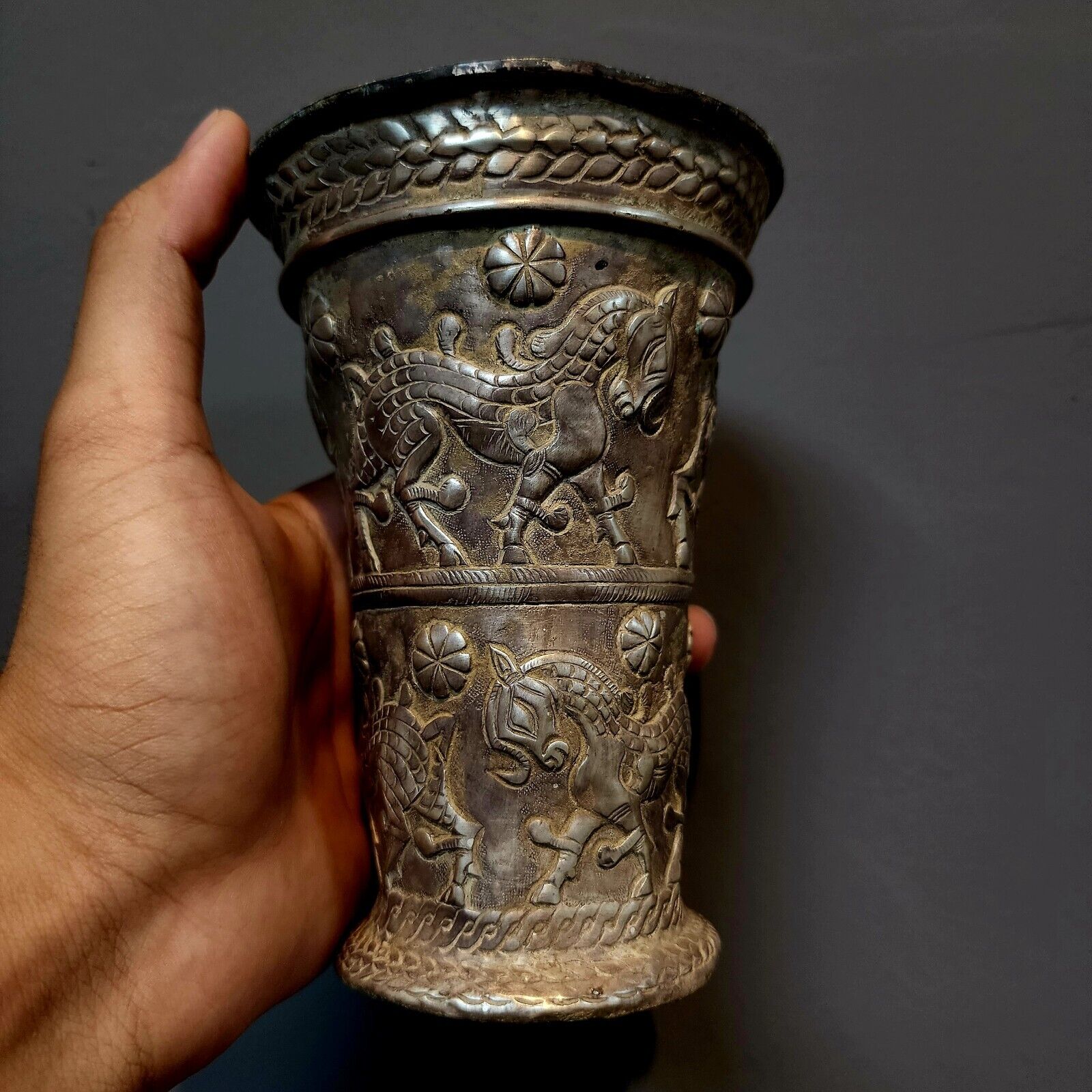 AN ACHAEMENID SILVER BEAKER WITH HORSES SCENE. SUPERB AND RARE