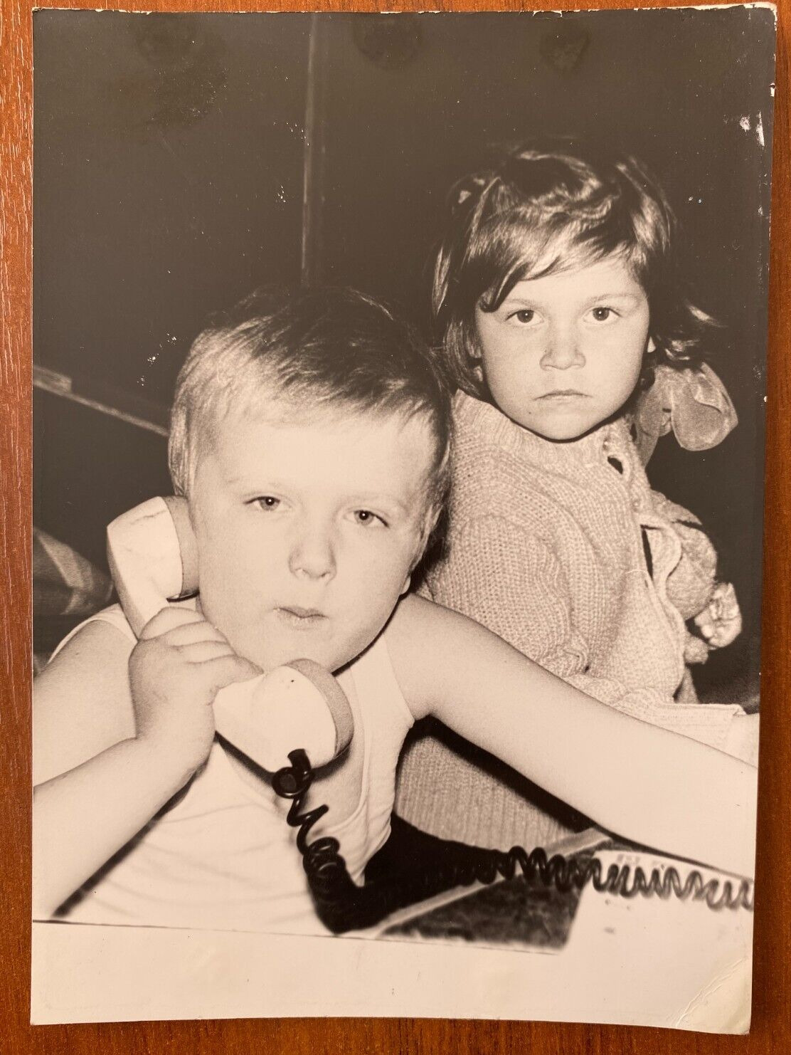 Beautiful boy with a phone and a girl, cute kids Vintage photo