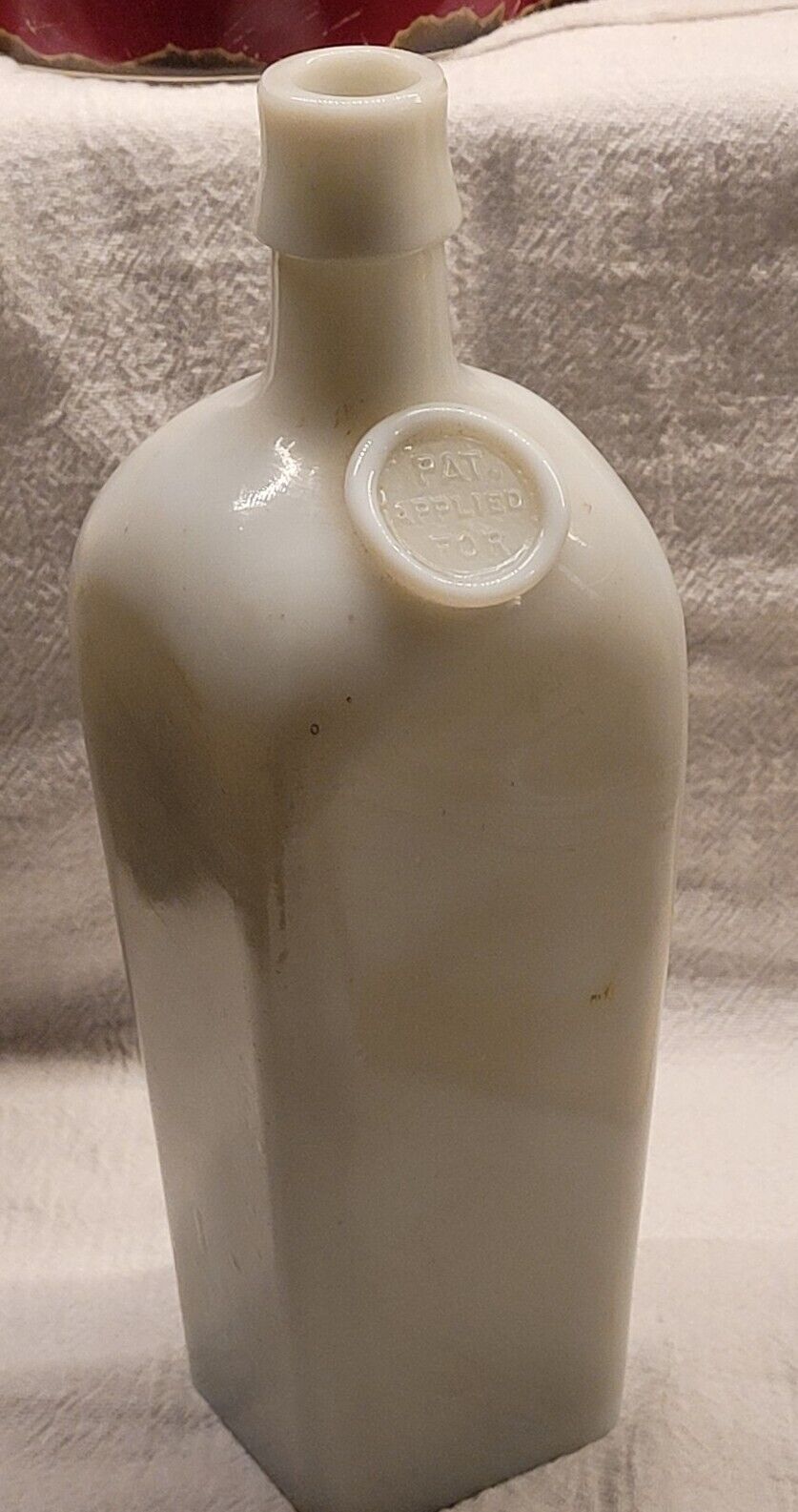 EMBOSSED S  B ROTHENBERG SOLE AGENTS WESTERN BITTERS GIN MILK GLASS APPLIED SEAL
