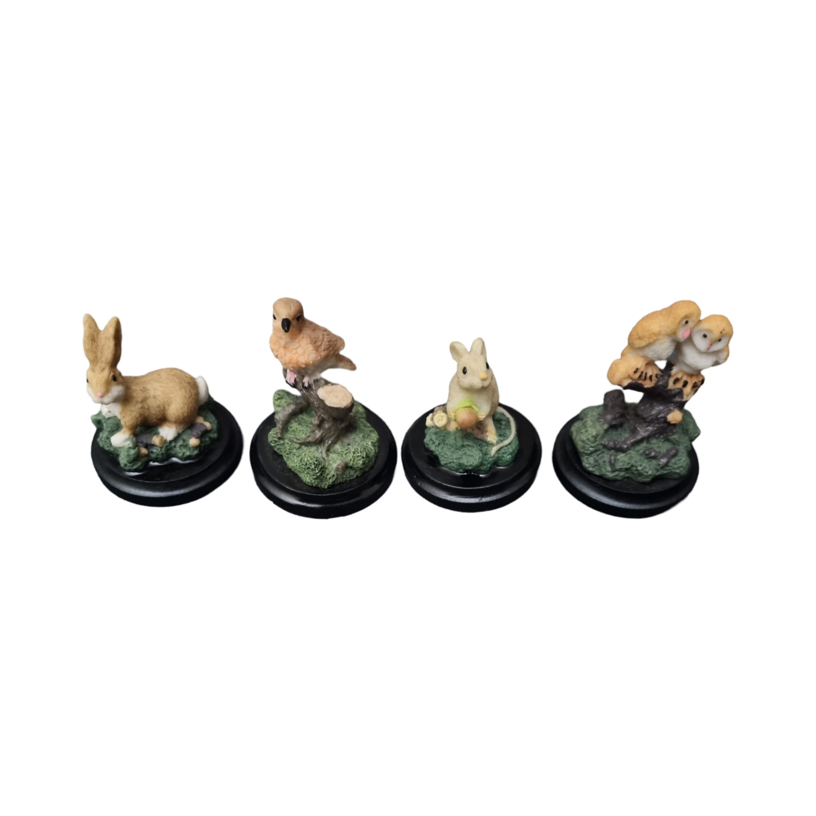 Set of 4 Small Ceramic Nature Animal Figurines with a Black Timber Base