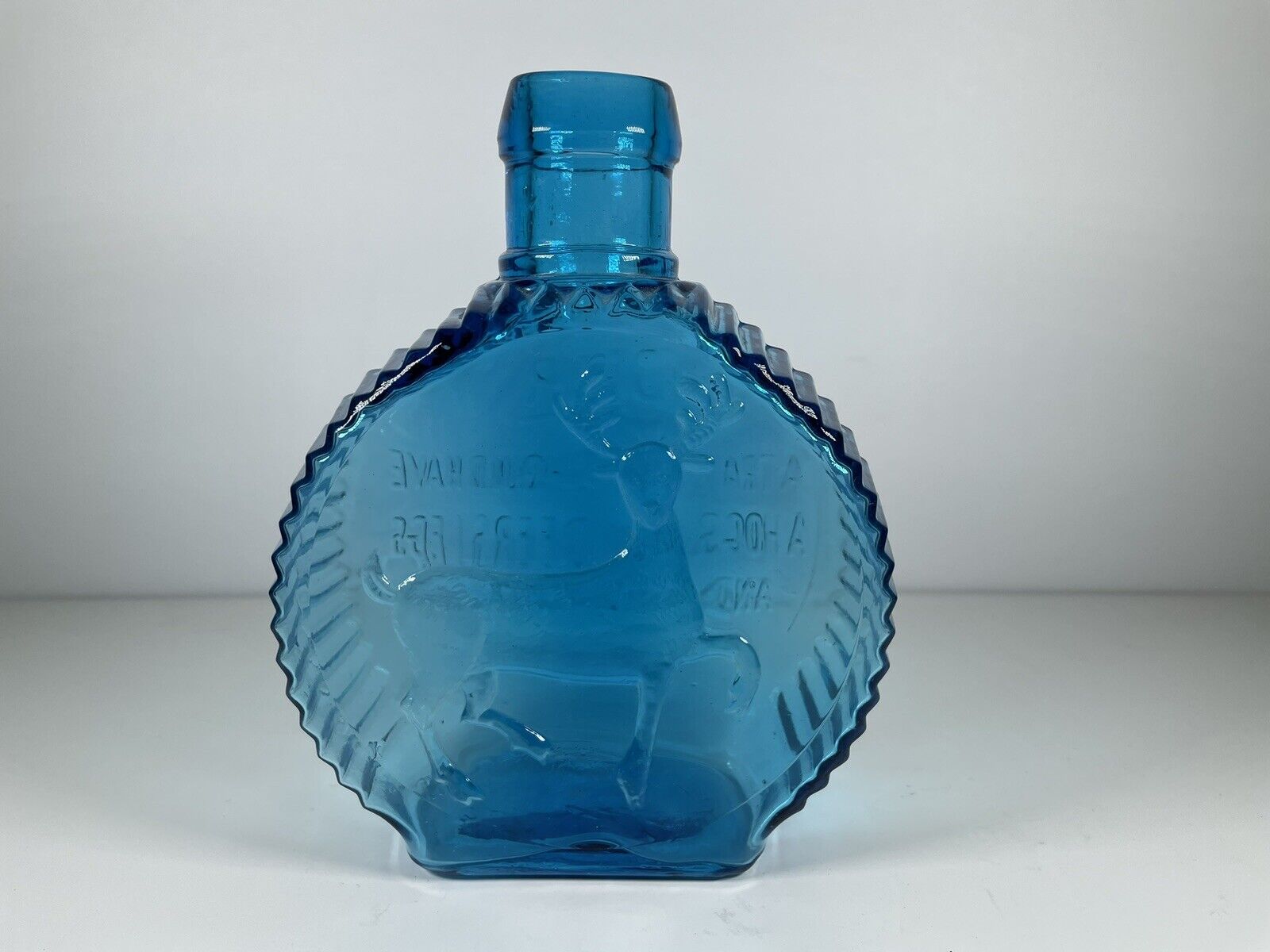 Clevenger Bros Deer A Traveler Blue Glass Bottle