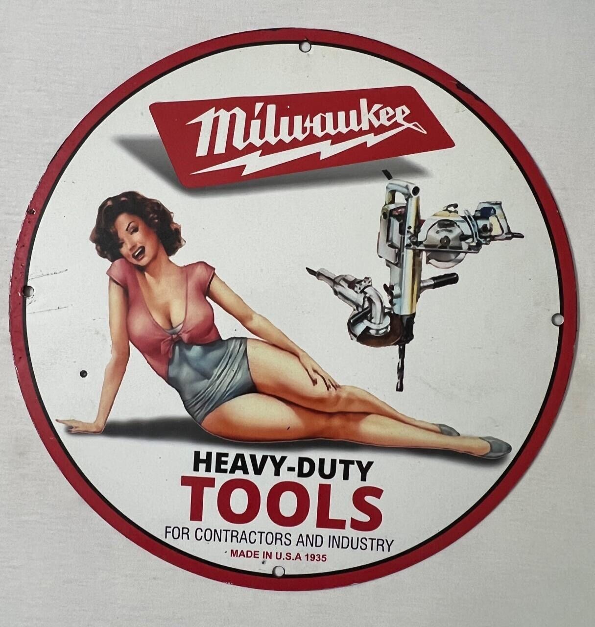 CLASSIC MILWAUKEE HEAVY DUTY TOOLS Pinup Porcelain Enamel Sign.