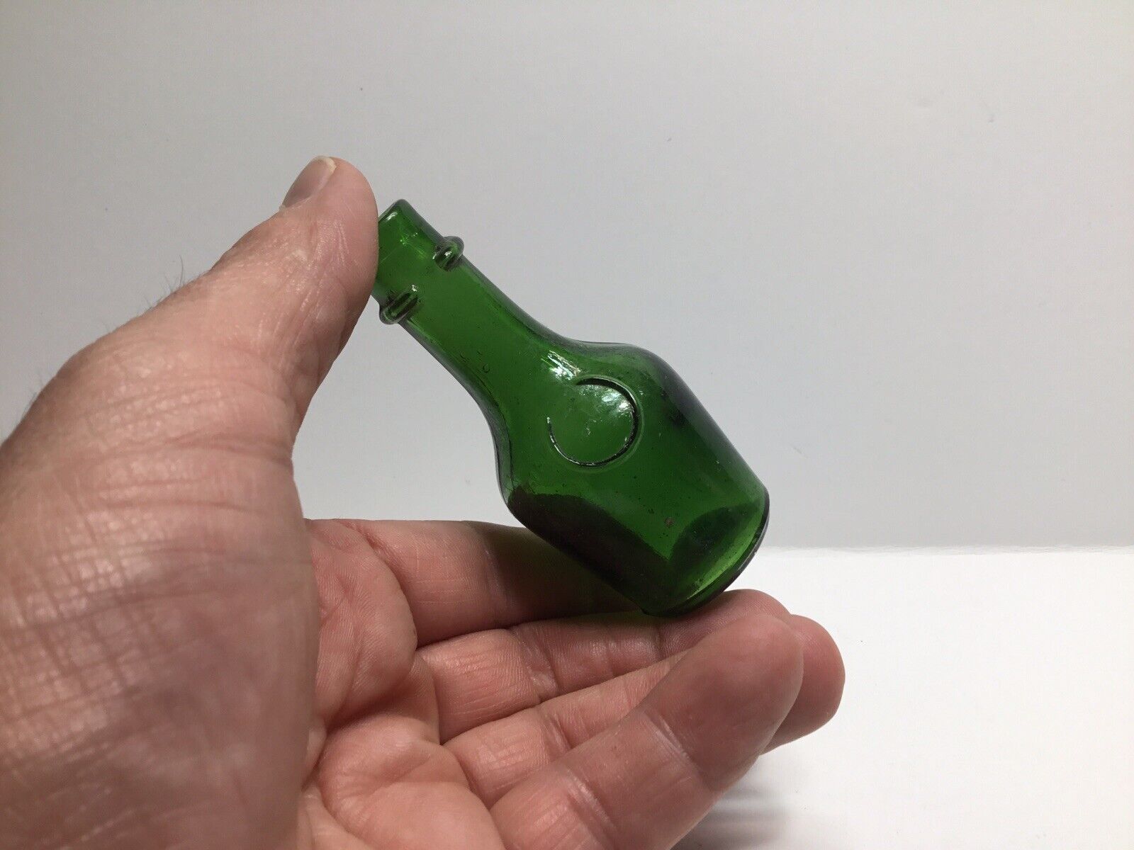 Small Antique Emerald Green Bénédictine Sample Size Liquor Bottle.