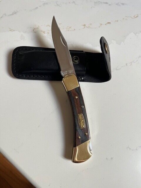 Buck 110 50th Anniversary Knife with leather sheath.