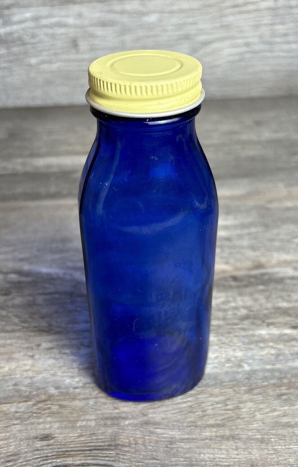 6” Cobalt Blue Medicine Bottle With Yellow Screw On Cap