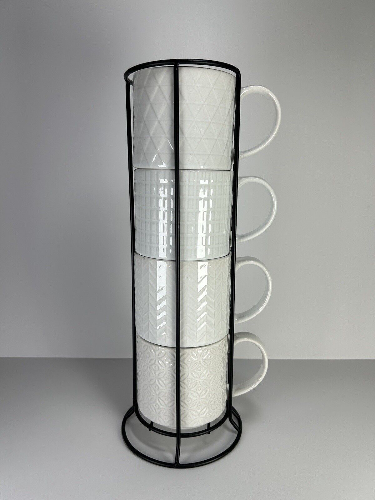 Over And Back White Embossed Design 4 Stackable Mugs With Metal Holder