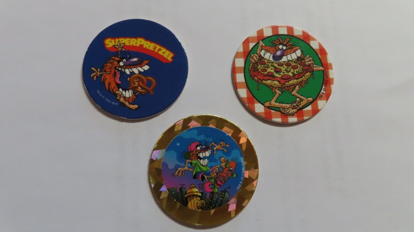 three different super pretzel mascot pogs 1994 1995