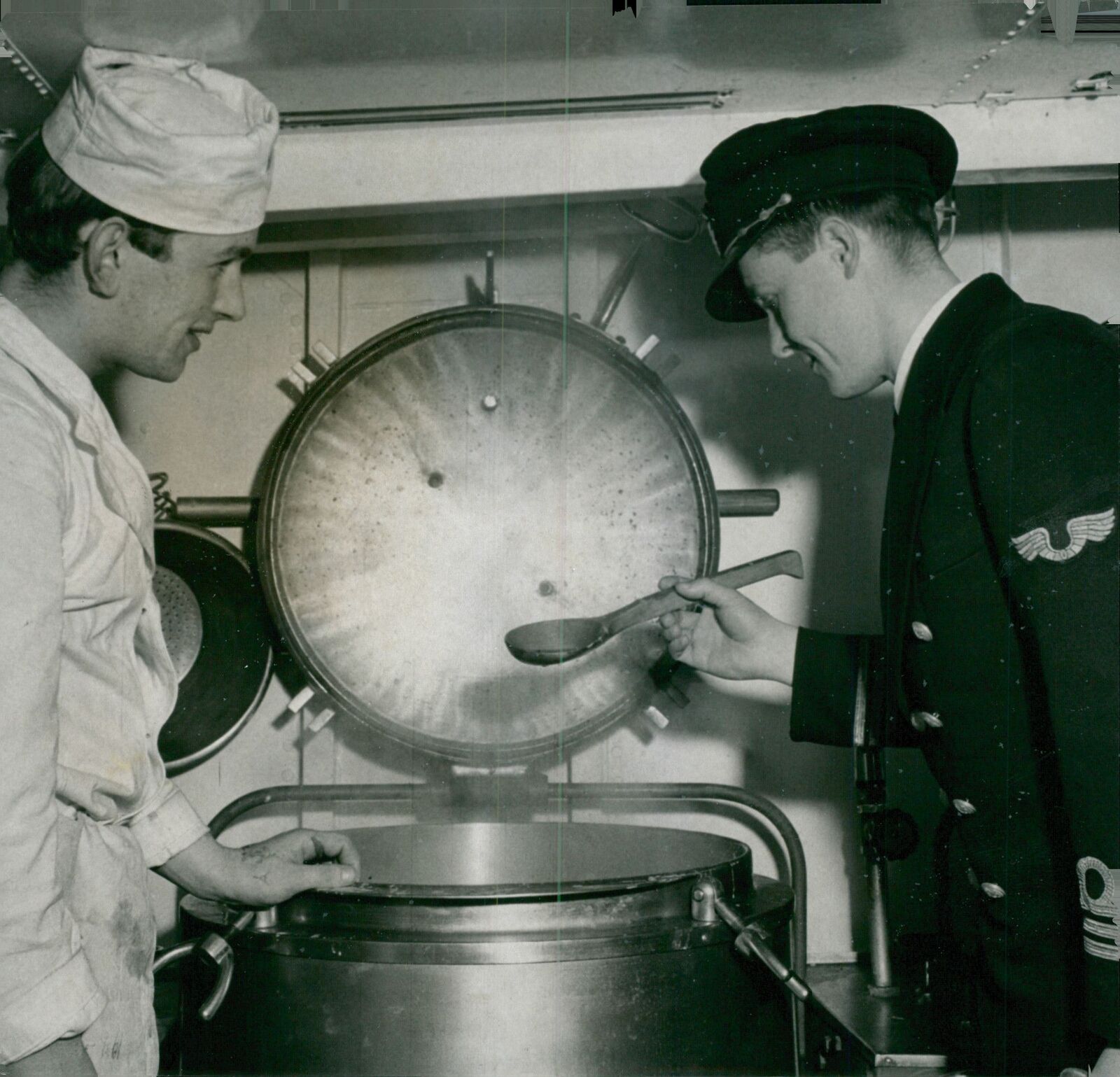 Captain L. Lindgren, savoring the pea soup that... - Vintage Photograph 553534