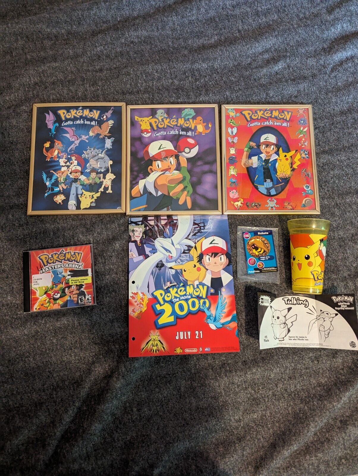 lot of vintage Pokemon posters, cup, and Masters PC Game