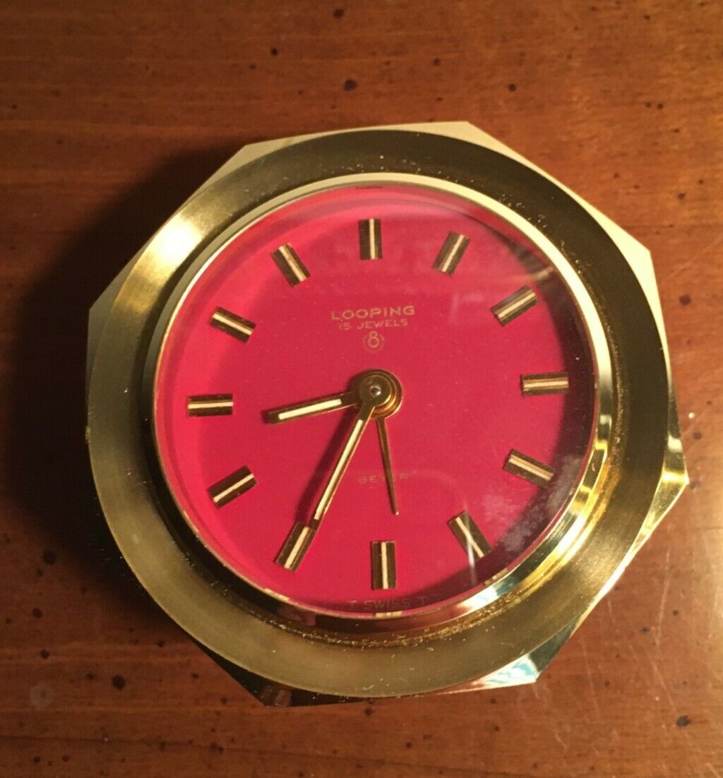 Looping Swiss clock,vintage, 2 1/4\