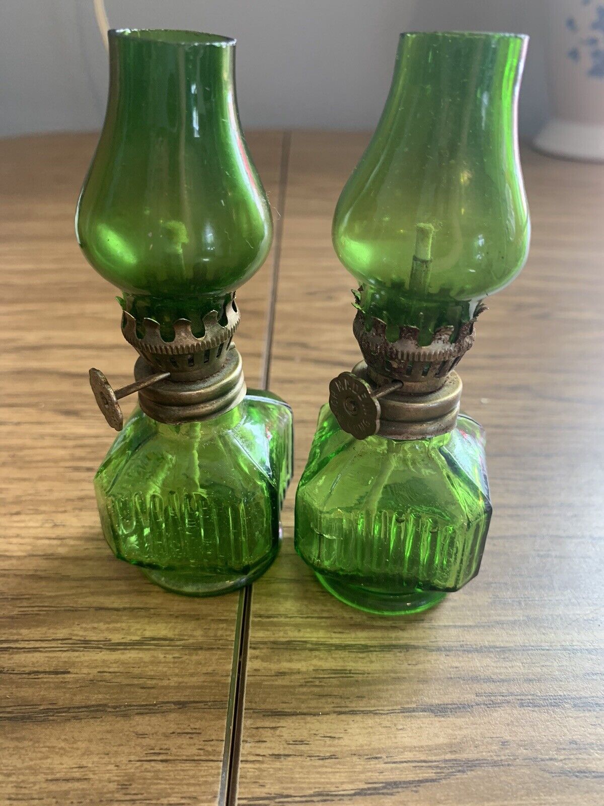 Miniature glass oil lamp with wick, antique. Green glass, approx 3.5 inches tall