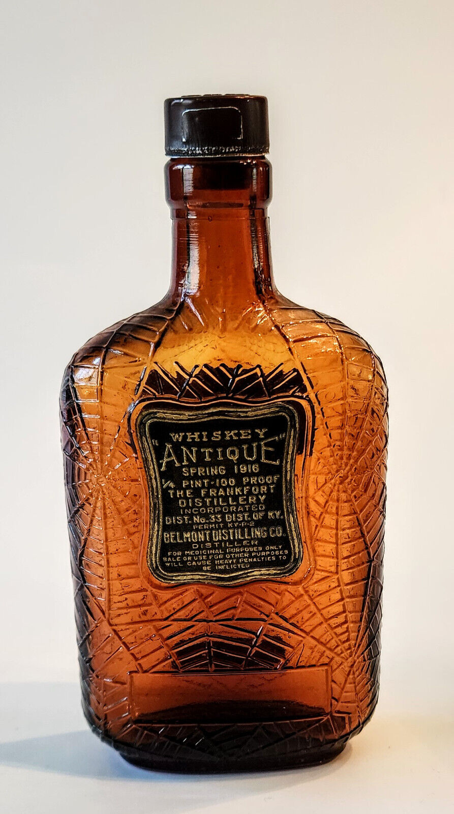 Antique Frumenti Spiritus Amber Whiskey Bottle Embossed Spider Web 1916