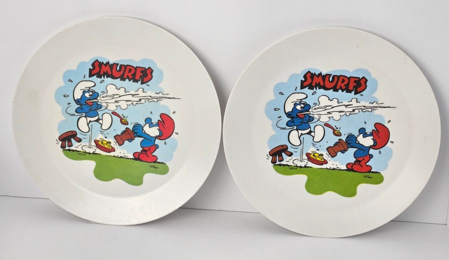 Two (2) Vintage 1980’s Deka Smurfs 8” Plastic Kids Plates Funny Scene Papa Smurf