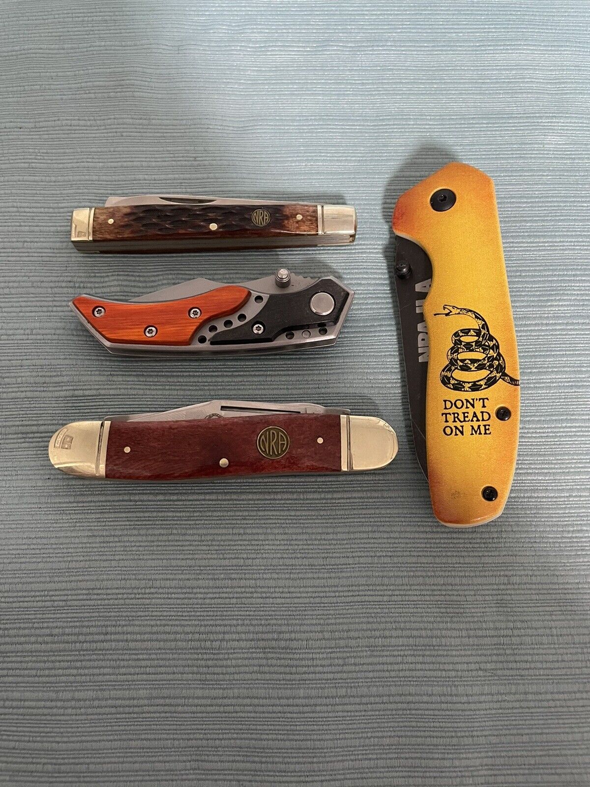 Lot of 4 NRA Pocket Knives 