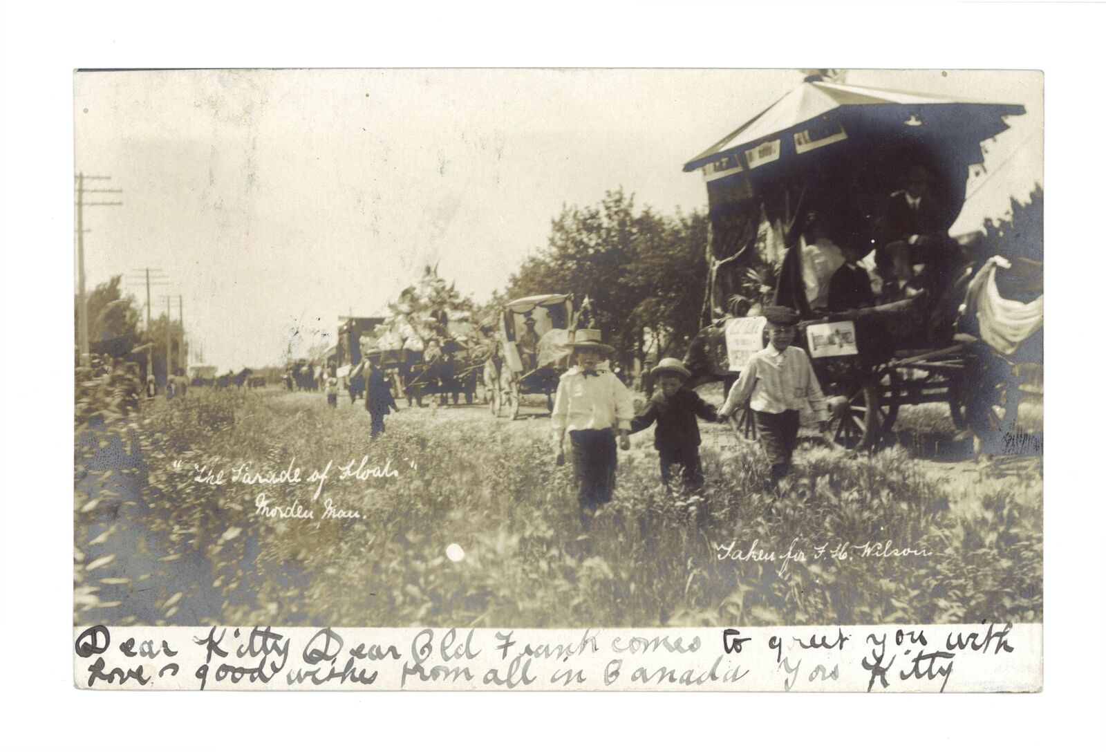 The parade of floats Morden Manitoba Children walking along side - Old Photo