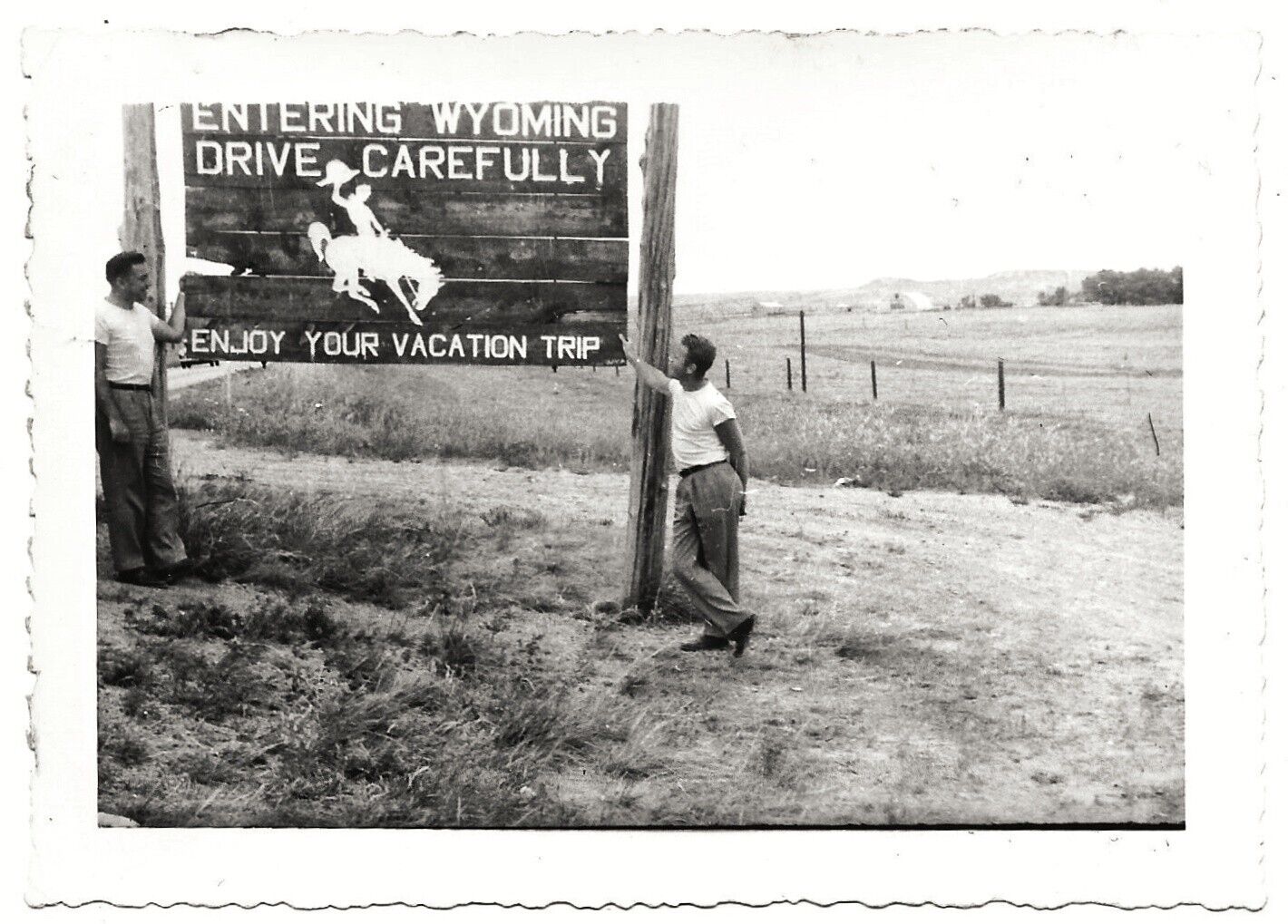 Vintage Old 1940s Photo of Men Standing Next To The Old Entering WYOMING Sign