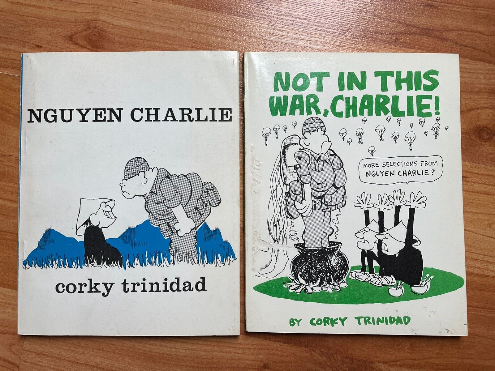2 VTG Corky Trinidad Cartoon Not In This War, Charlie Nguyen Charlie Paperbacks