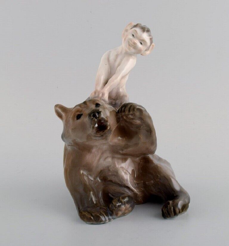 Royal Copenhagen porcelain figurine. Faun pulling bear's ear. Model number 1804.