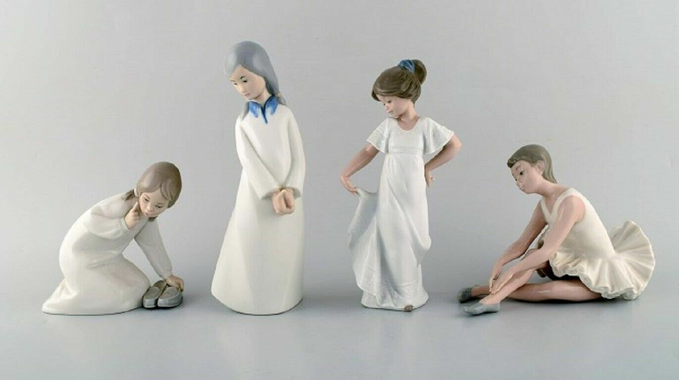 Lladro, Nao and Rex, Spain. Four porcelain figurines of young girls. 1970/80's. 