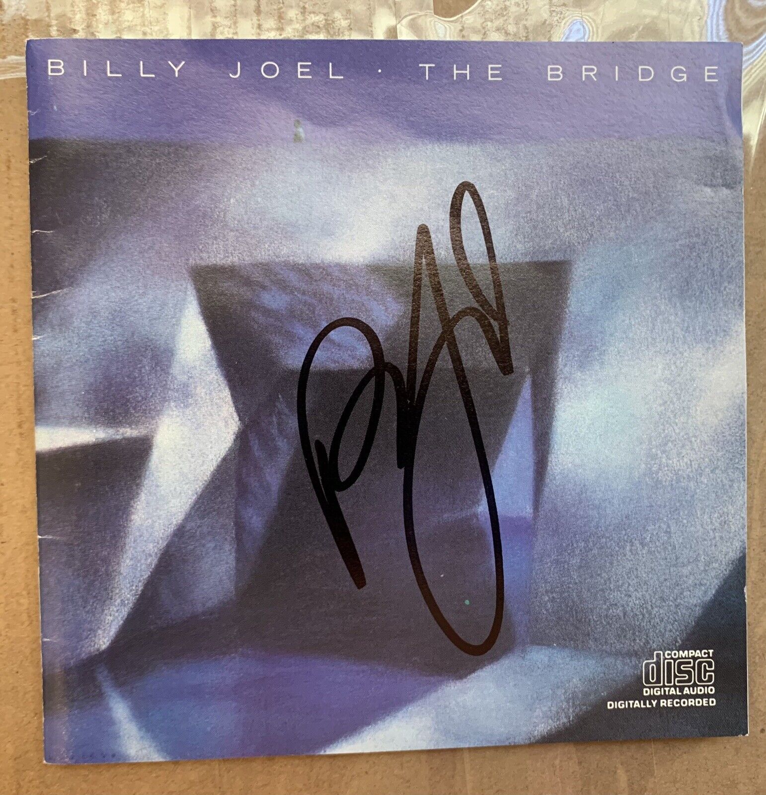 Billy Joel Autographed CD of The Bridge .  Obtained after MSG show by huge fan.