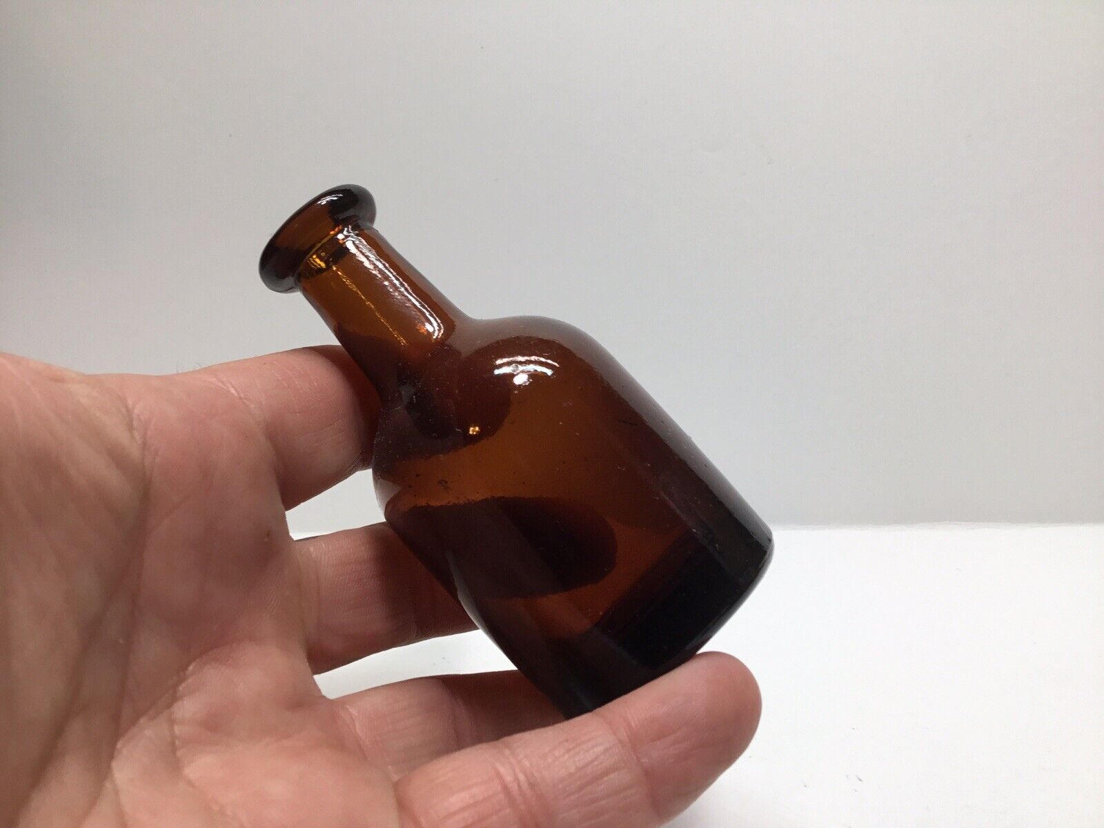 Small Squatty Antique Sample Size Liquor Bottle.