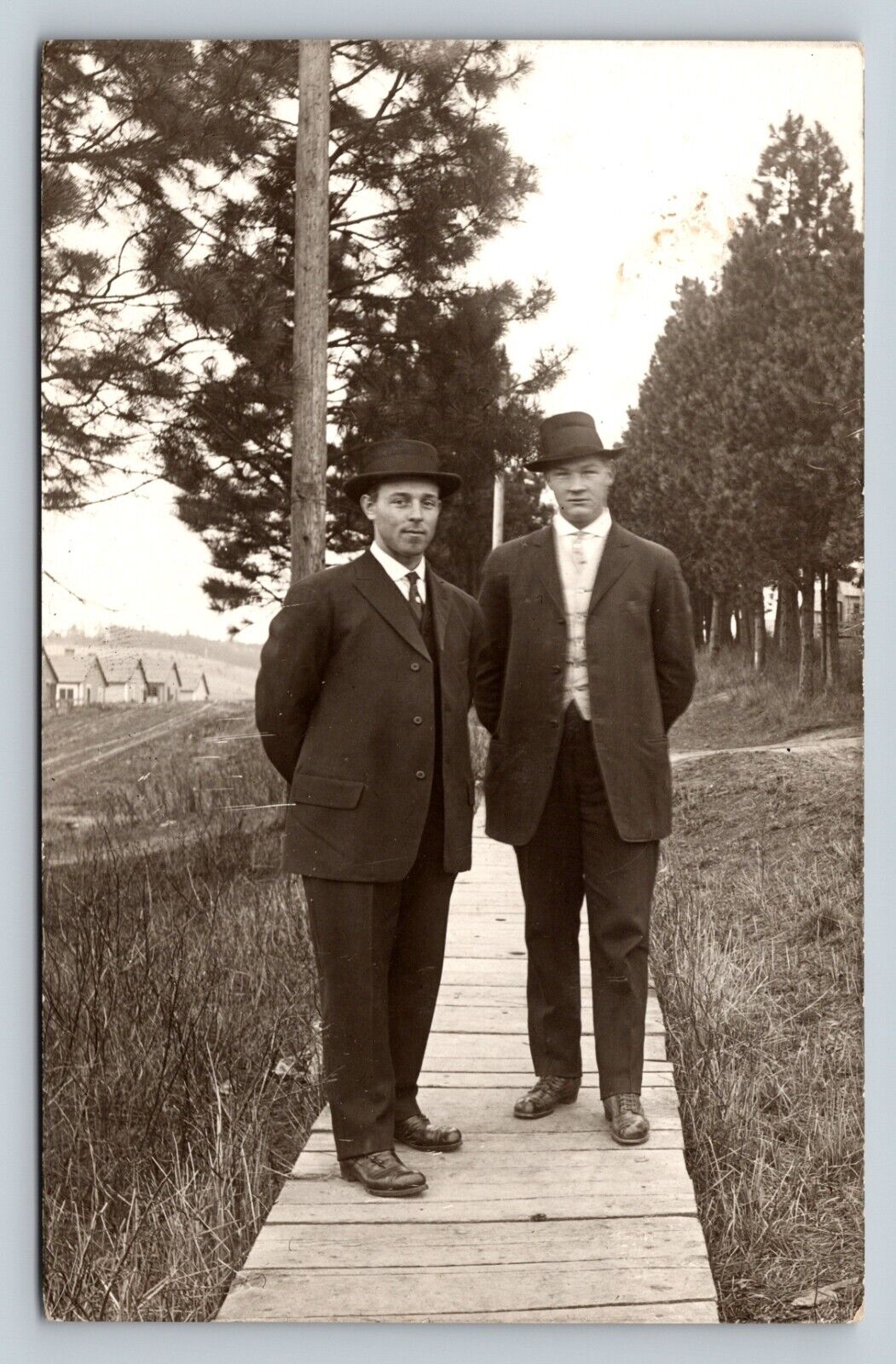 RPPC Men Standing On Wooden Sidewalk Suits FASHION ANTIQUE Postcard AZO 1904-18