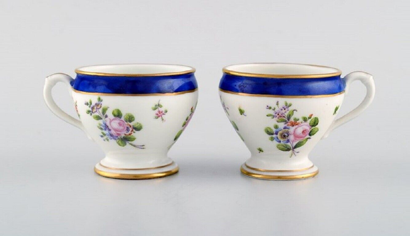 Sevres, France. Two antique cream cups in hand-painted porcelain. 19th C.