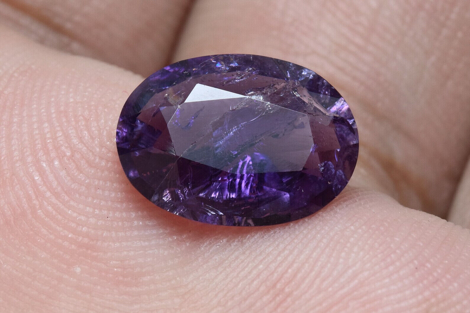 2.50 Carat Oval Faceted Fluorescent Purple Scapolite Gemstone