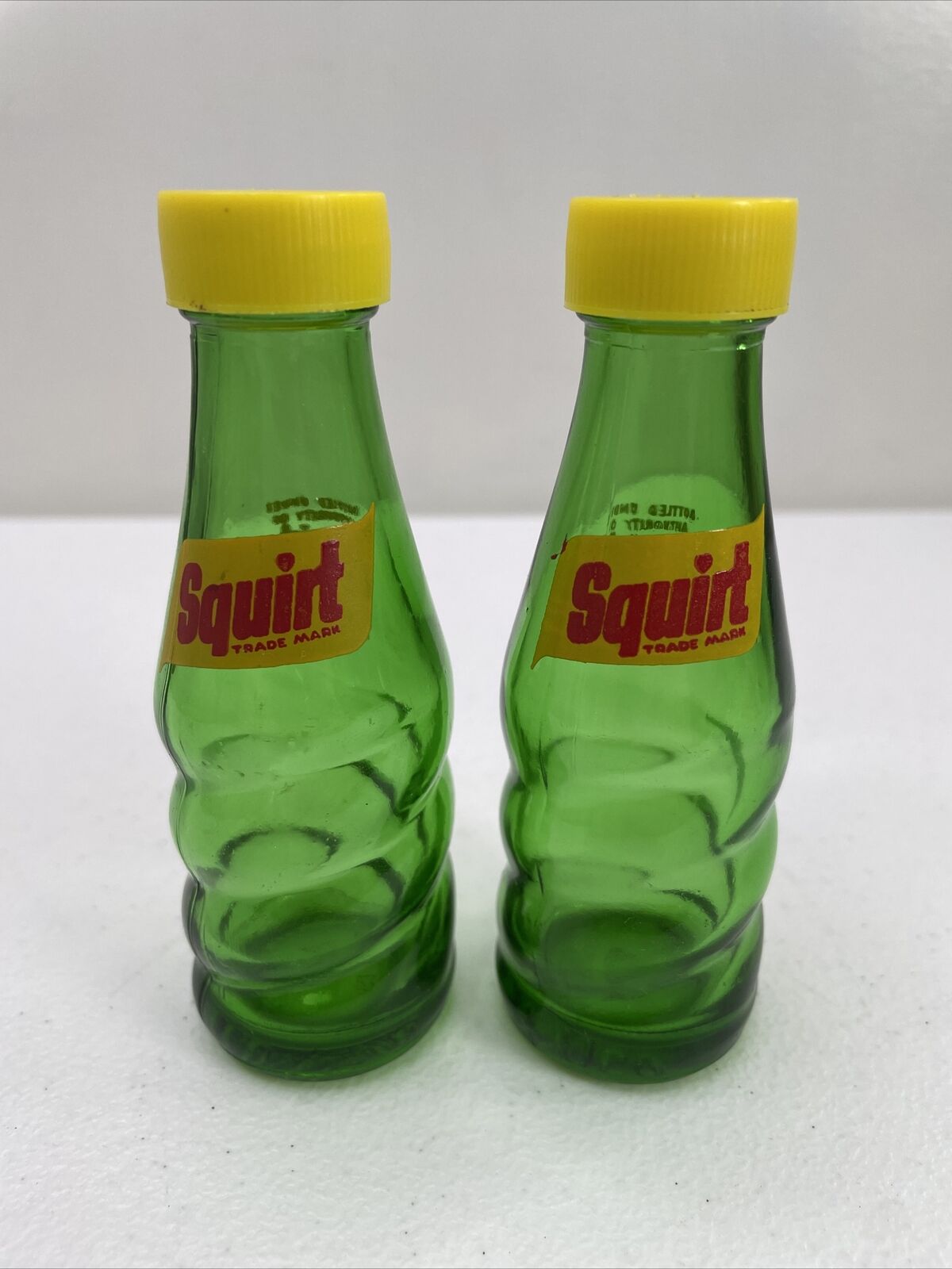 Squirt Soda Salt And Pepper Shakers Vintage 1974 Glass With Plastic Tops