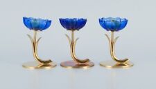 Gunnar Ander for Ystad Metall. Three candlesticks in brass and blue art glass picture