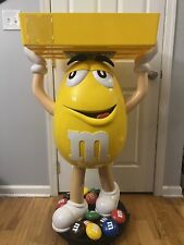 Yellow M&M Guy Store Display With Tray On Wheels picture