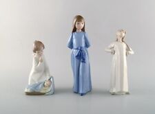 Nao and Lladro. Three porcelain figures. 20th century picture