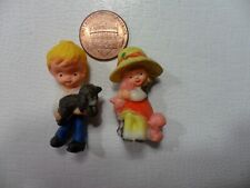 Plastic Miniature Boy and Girl Holding Puppies - Vintage - Made in Hong Kong picture