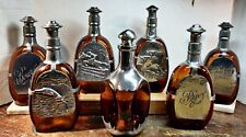 SET OF 7 VINTAGE ROYAL DAALDEROP AND QUEEN'S ART PEWTER AND AMBER DECANTERS picture