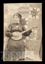 ID'd Girl Playing the Banjo in Front of Homemade Quilt Backdrop RPPC Photo 1910s picture