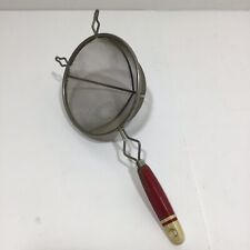 Vintage Metal Strainer with Red/Yellow Wooden Handle picture