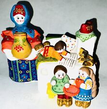 Vintage Russian Clay Sculpture Depicting A Peasant Family Around A Warm Oven picture