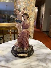 De Elina Collector's Figurine 10 inches x 5 inches. Woman With Cherub Angel. picture