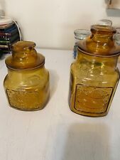 A Pair Of vintage Wheaton , NJ  Honey Amber Glass Jar with Lid fish And Heart picture