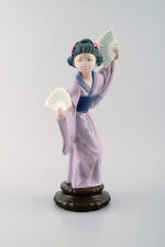 Lladro, Spain. Large figure in glazed porcelain. Geisha with fans. 20th century. picture
