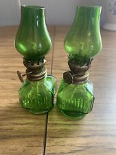 Miniature glass oil lamp with wick, antique. Green glass, approx 3.5 inches tall picture