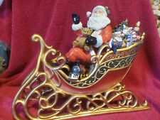 PORCELAIN SANTA IN SLEIGH  WITH TOYS  11 x 13 INCHES picture