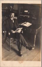 Vintage 1910s Real Photo RPPC Postcard Office Scene - Man at Desk, Reading Book picture