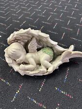 Pre Owned Enchanting Ceramic Sleeping Angel Baby Laying On A Bed Of Angel Wings picture