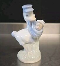 Vintage Porcelain Bird Stork Carrying Baby Infant Figurine picture