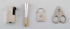 Four pieces Danish silver. Lighter, cigarette holder and two cigar clippers. picture