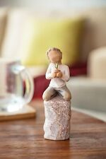 Small Resin of a Child Holding a Green Plant Handmade Carved Multicolor Figurine picture