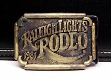 Raleigh Lights Rodeo 1981 Brass Belt Buckle Pre-Owned  picture